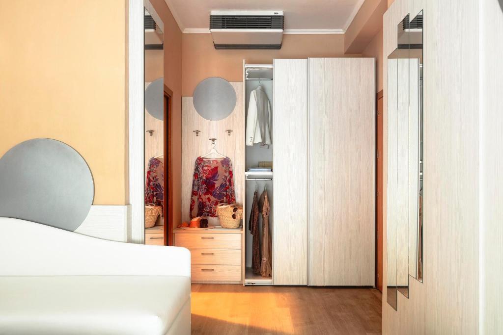 Postel nebo postele na pokoji v ubytování Hotel Ombretta Mare