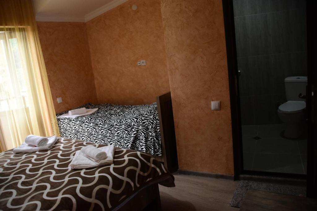 Postel nebo postele na pokoji v ubytování Maia's Guesthouse