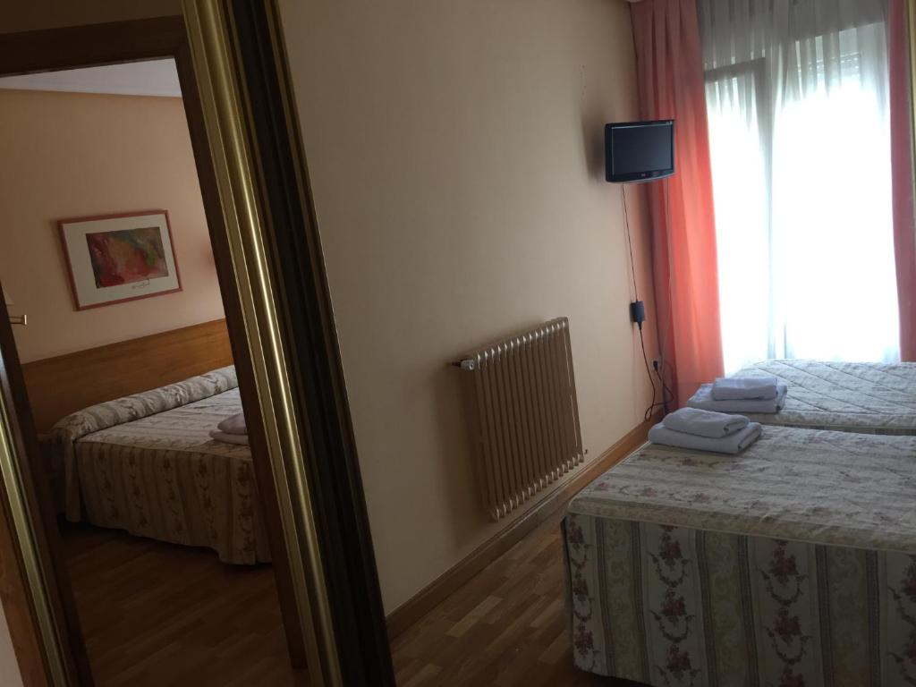 Postel nebo postele na pokoji v ubytování Hotel Benlloch