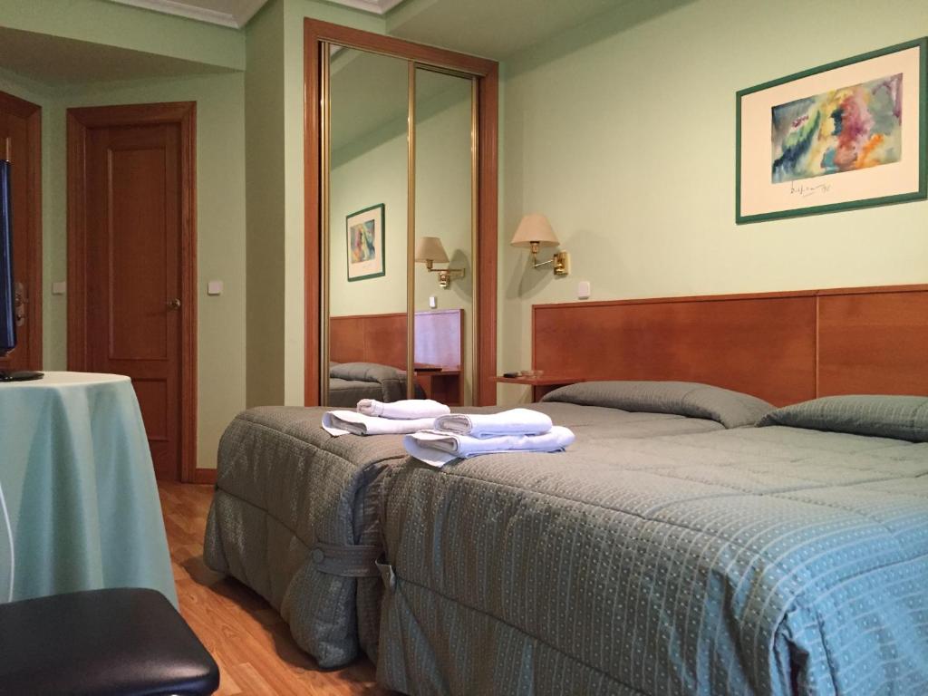 Postel nebo postele na pokoji v ubytování Hotel Benlloch