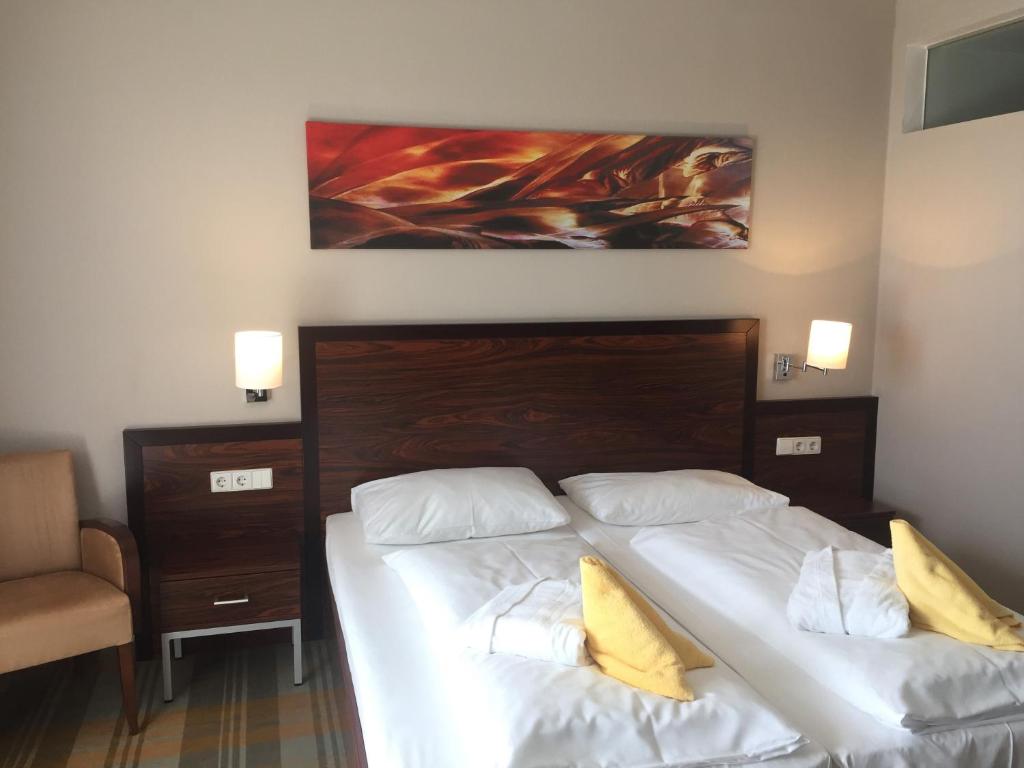 Postel nebo postele na pokoji v ubytování Hotel Liebmann