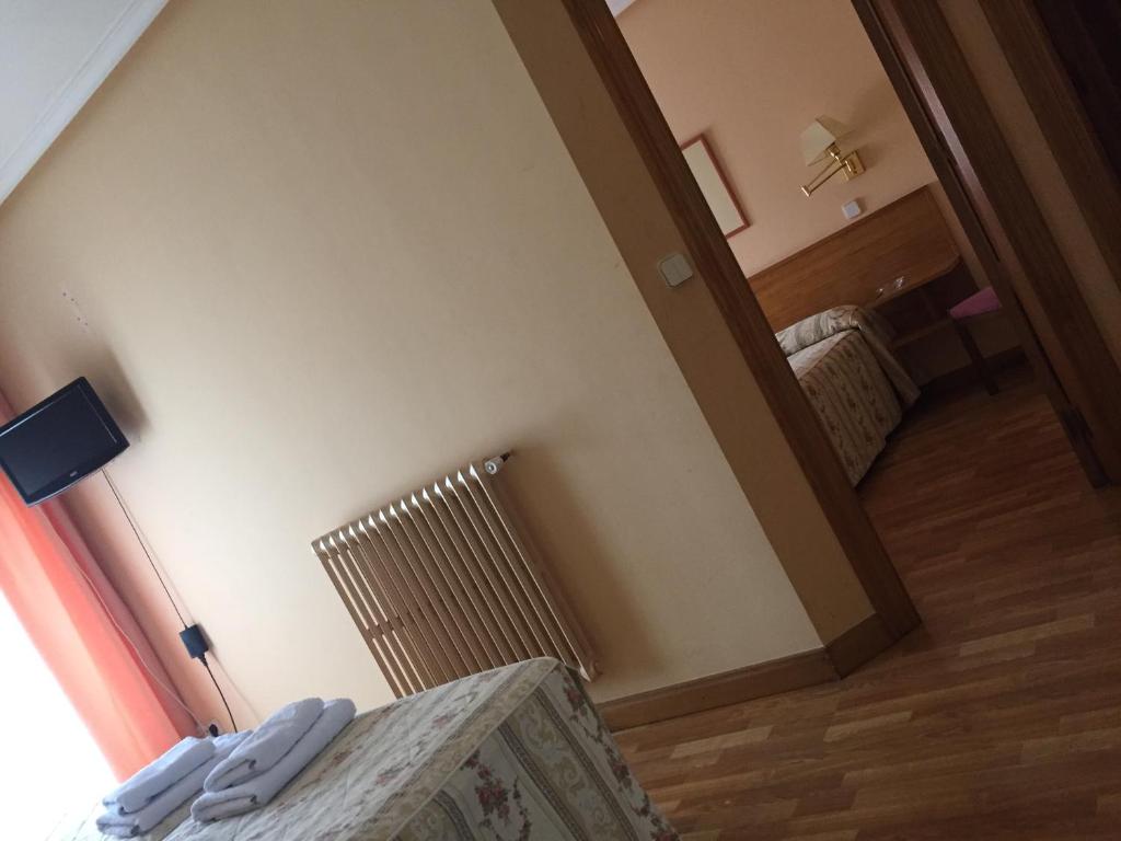Postel nebo postele na pokoji v ubytování Hotel Benlloch