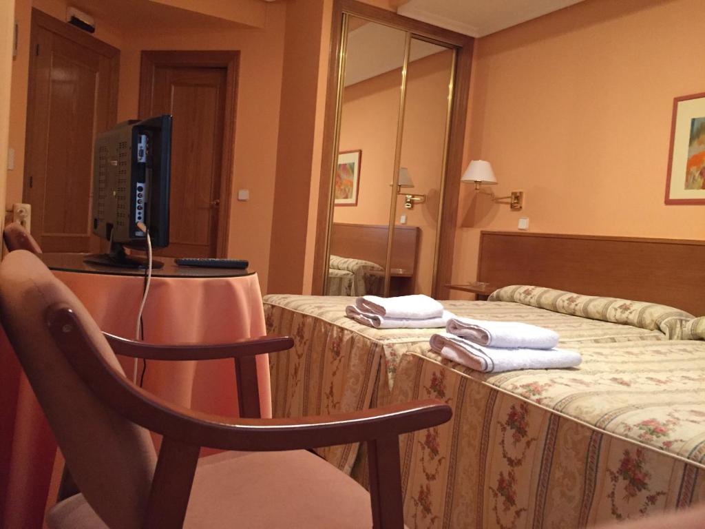Postel nebo postele na pokoji v ubytování Hotel Benlloch