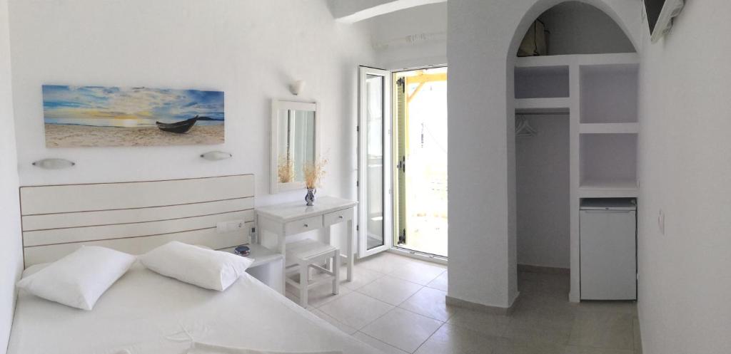 Cama ou camas em um quarto em Aegeo Inn