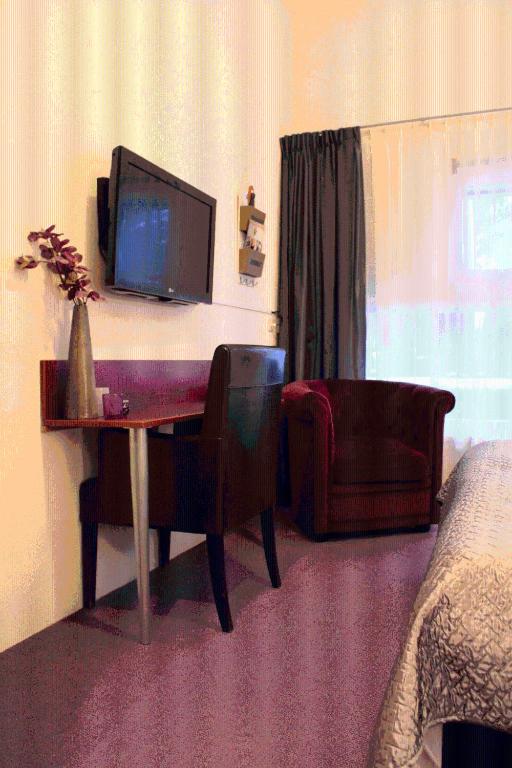 TV a/nebo společenská místnost v ubytování Parkhotel Hugo de Vries