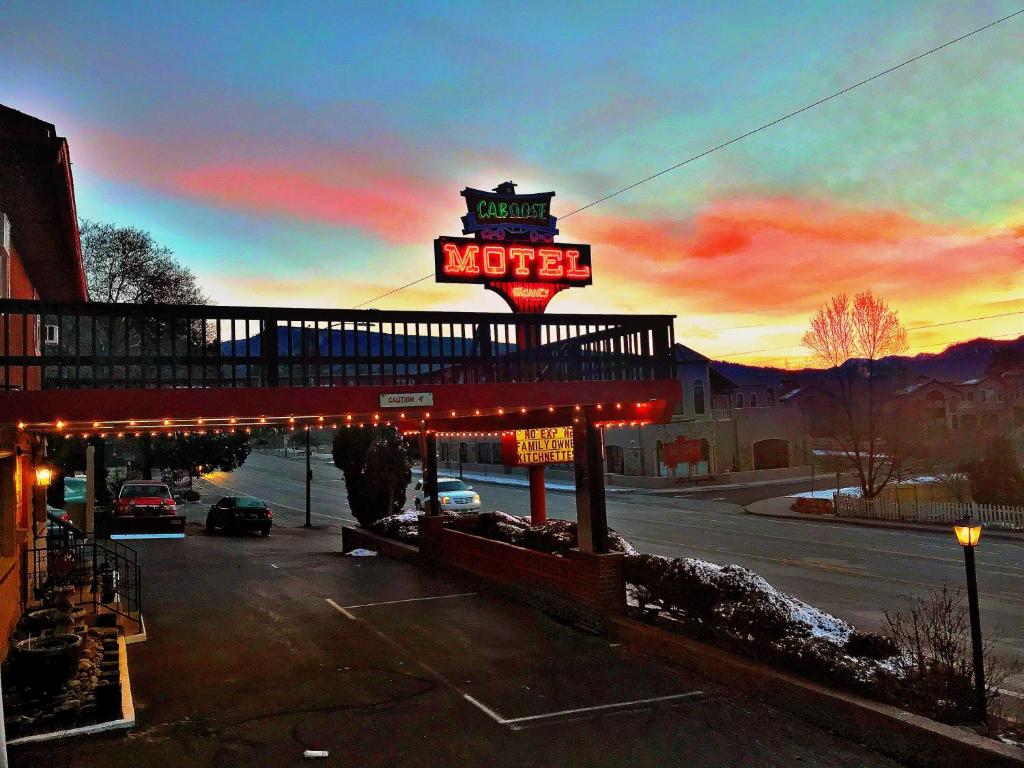 a motel sign in front of a parking lot at Caboose Motel & Gift Shop in Durango