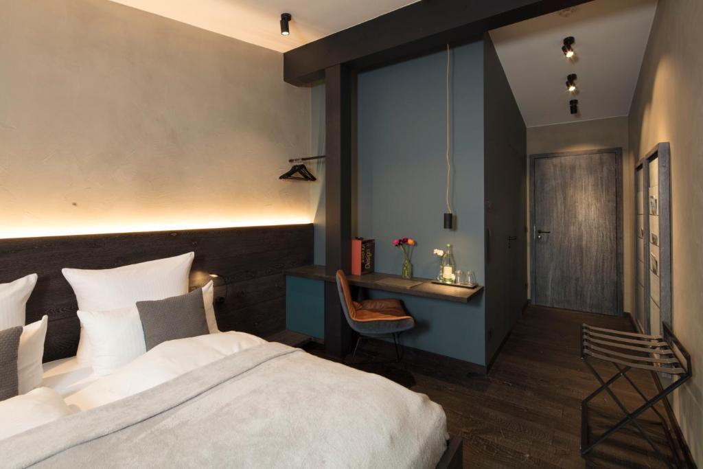 Postel nebo postele na pokoji v ubytování Wailtl Hotel