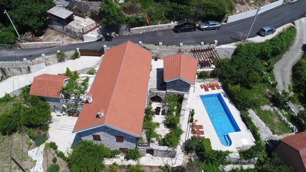 an aerial view of a house with a swimming pool at Mediteraneo Villa in Kaluđerovići