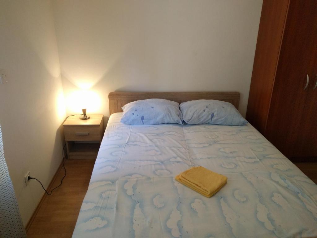 Posteľ alebo postele v izbe v ubytovaní Apartments Kuzman