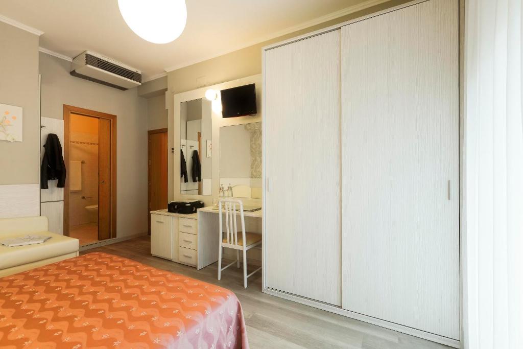 Postel nebo postele na pokoji v ubytování Hotel Ombretta Mare