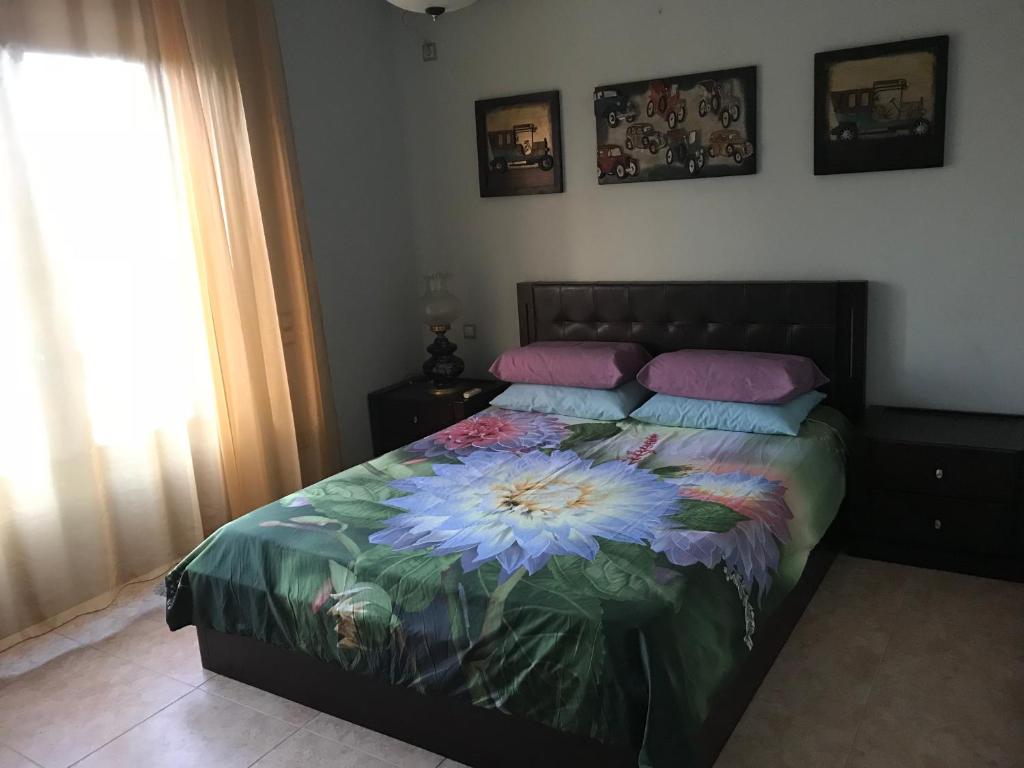 Postel nebo postele na pokoji v ubytování Loy Loy House