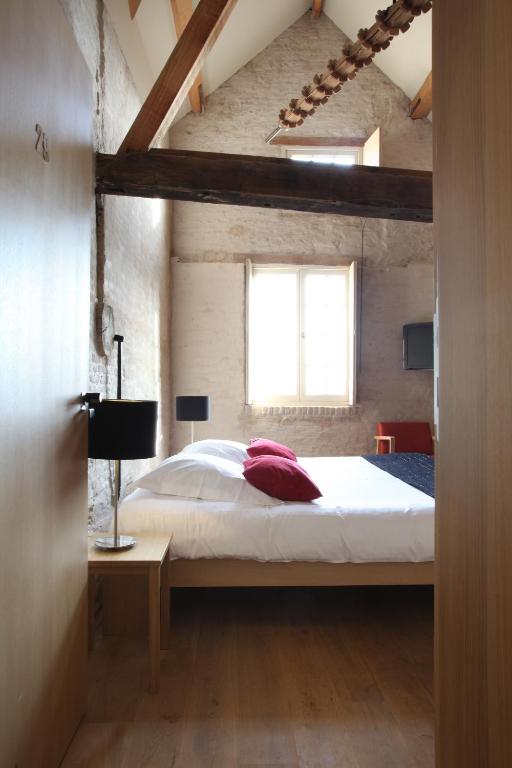Postel nebo postele na pokoji v ubytování 'S Hertogenmolens Hotel