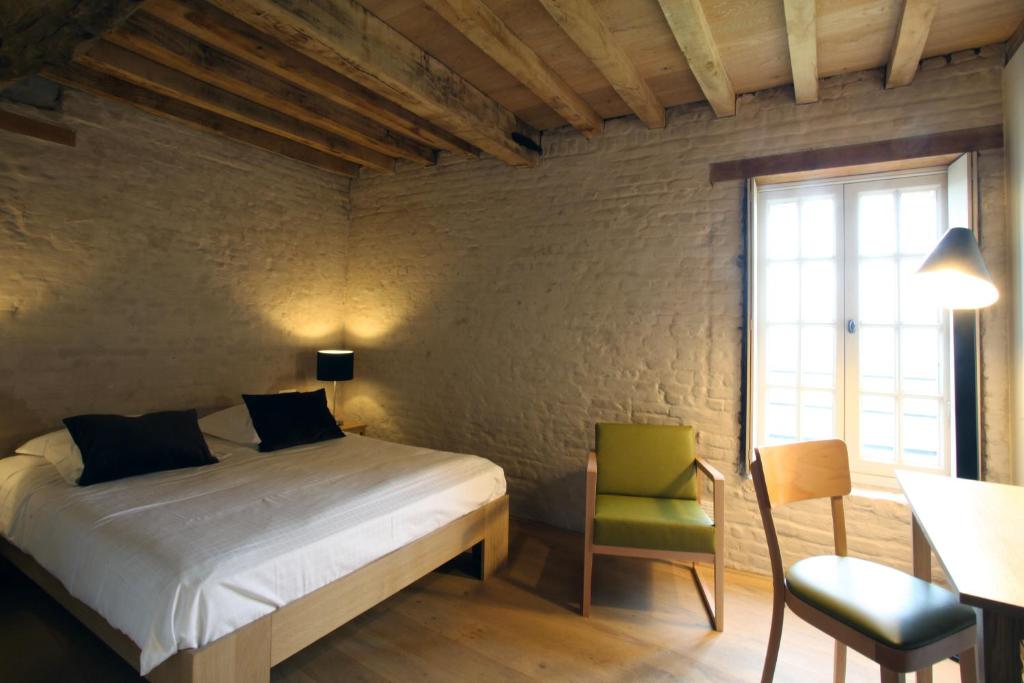 Postel nebo postele na pokoji v ubytování 'S Hertogenmolens Hotel