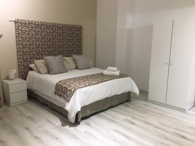 Ένα ή περισσότερα κρεβάτια σε δωμάτιο στο La Posada Pachino Rooms