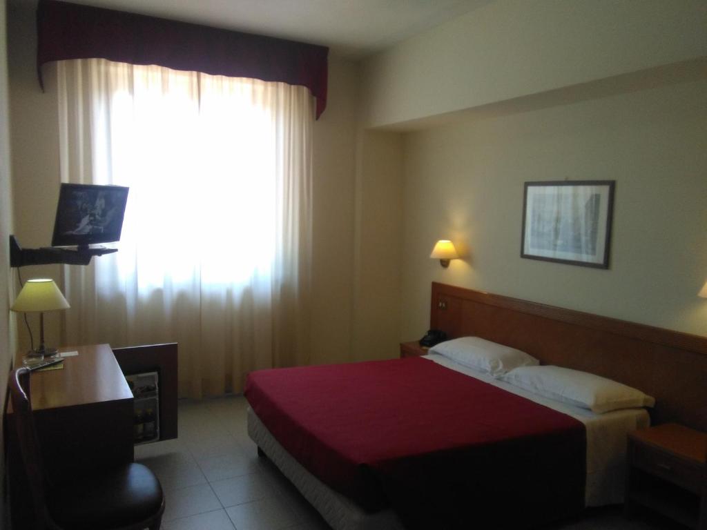 Postel nebo postele na pokoji v ubytování Hotel il Focolare