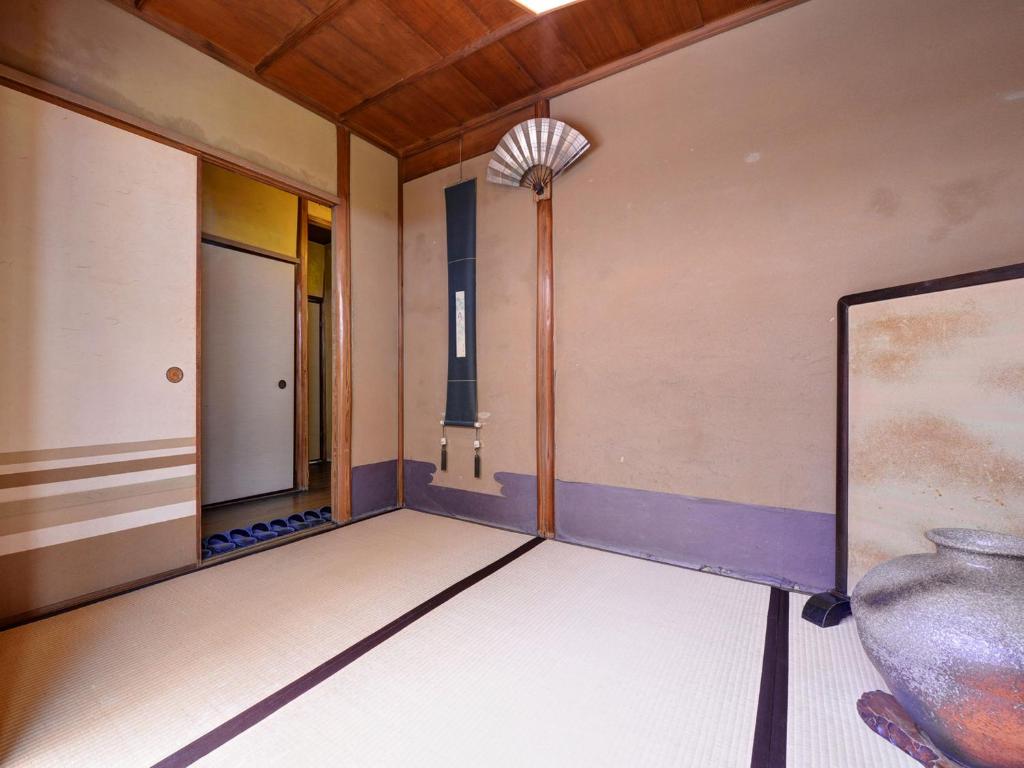 Postel nebo postele na pokoji v ubytování Ryokan Inakatei