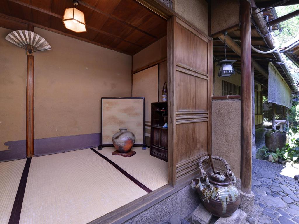 Postel nebo postele na pokoji v ubytování Ryokan Inakatei