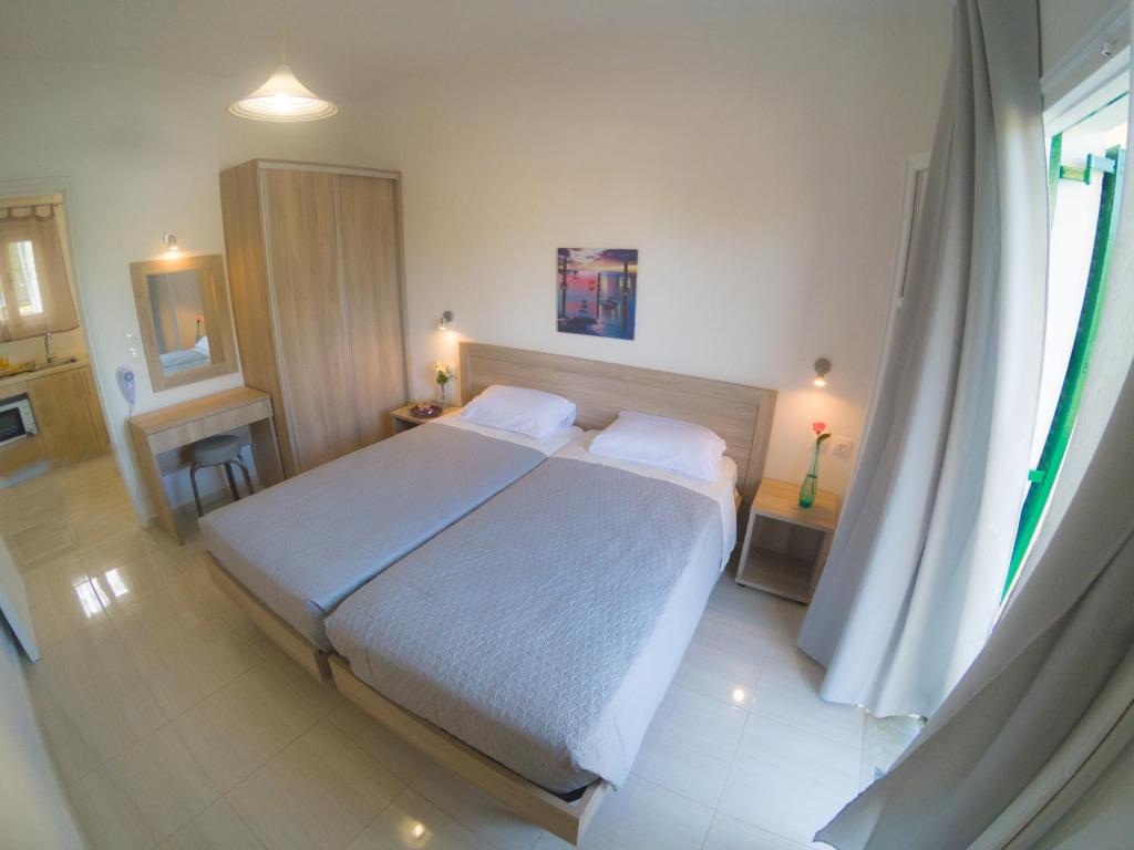 Postel nebo postele na pokoji v ubytování Yianetta Hotel Apartments