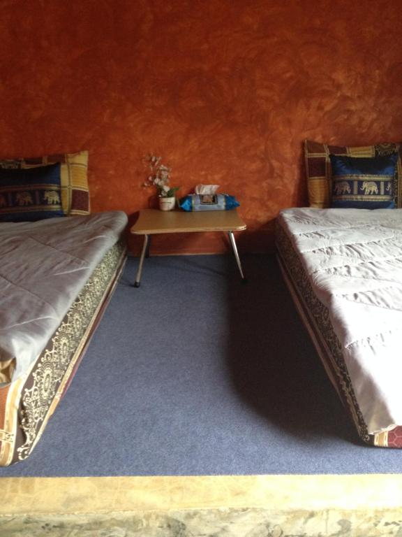 Postel nebo postele na pokoji v ubytování Milin Guesthouse