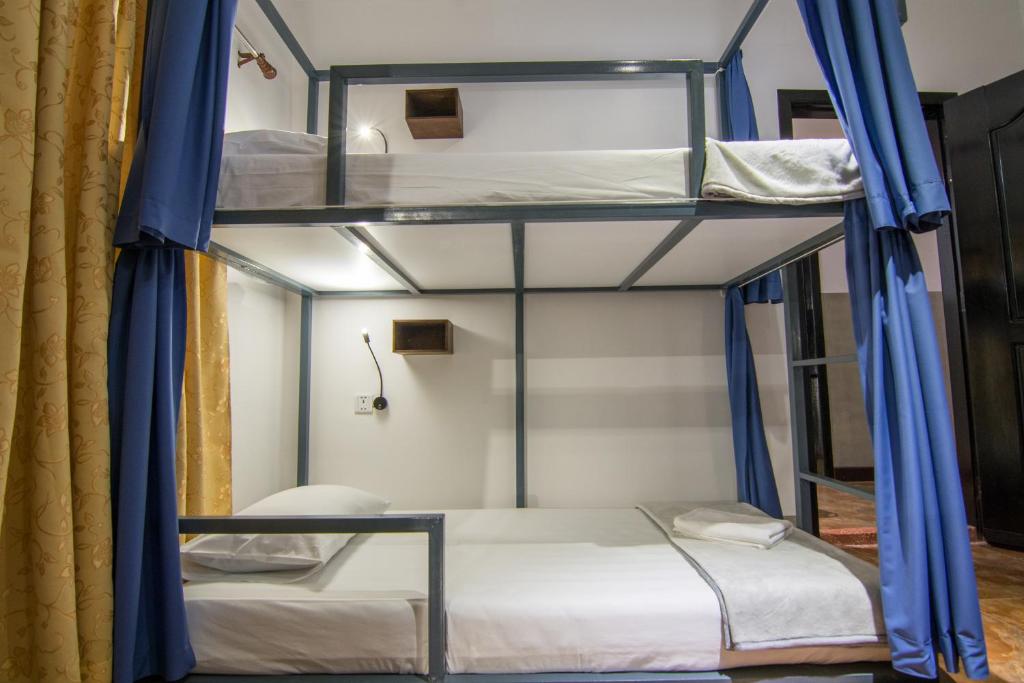 Postel nebo postele na pokoji v ubytování Bokre Angkor Hostel