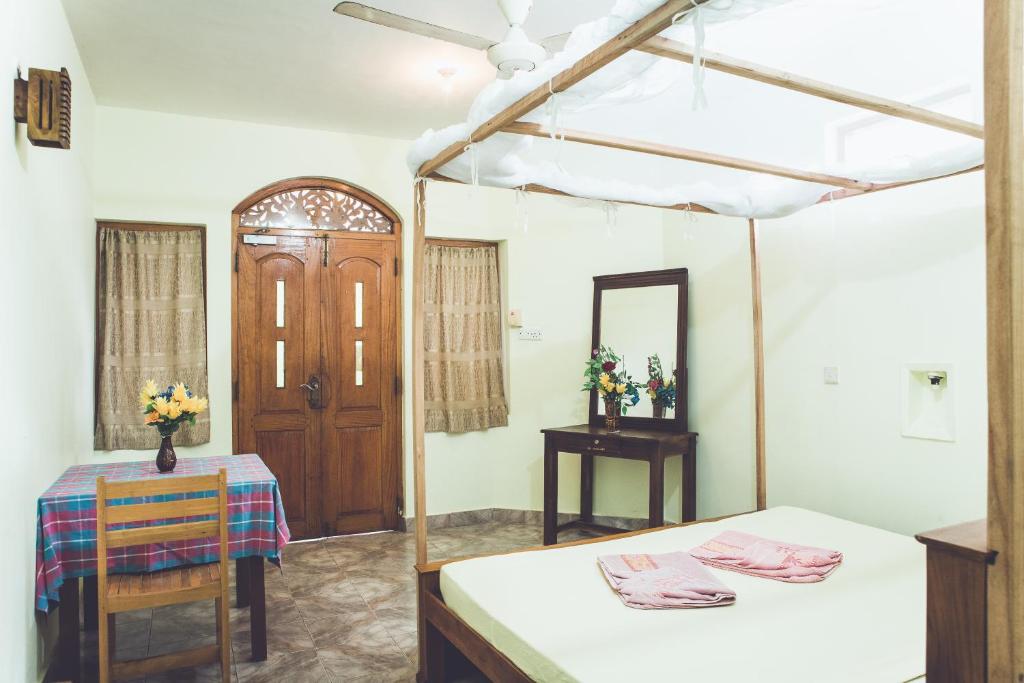 Postel nebo postele na pokoji v ubytování Rupa's Hotel