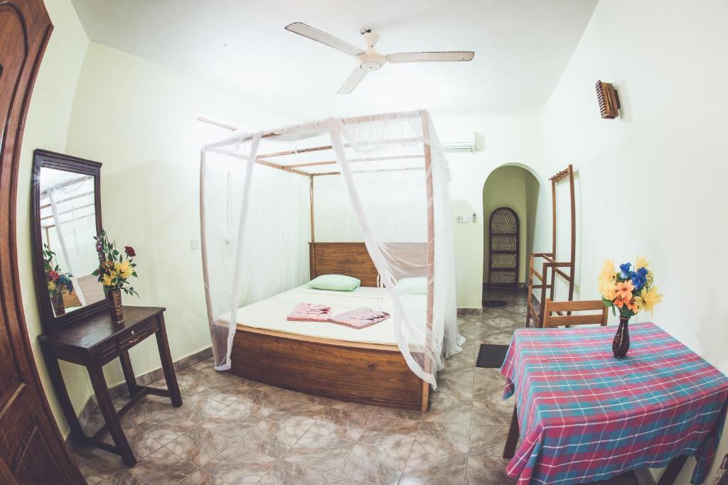 Postel nebo postele na pokoji v ubytování Rupa's Hotel