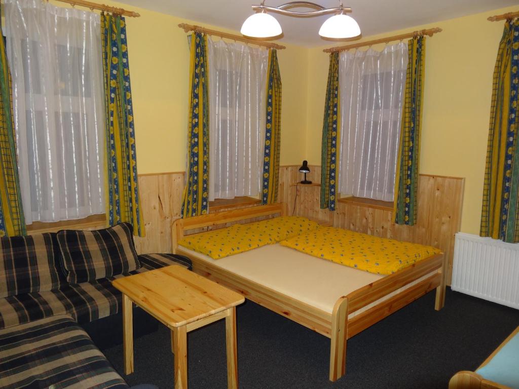 Postel nebo postele na pokoji v ubytování Penzion Na Rozcestí