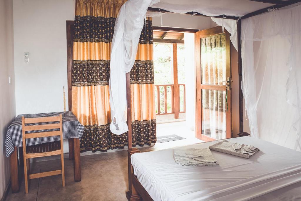 Postel nebo postele na pokoji v ubytování Rupa's Hotel