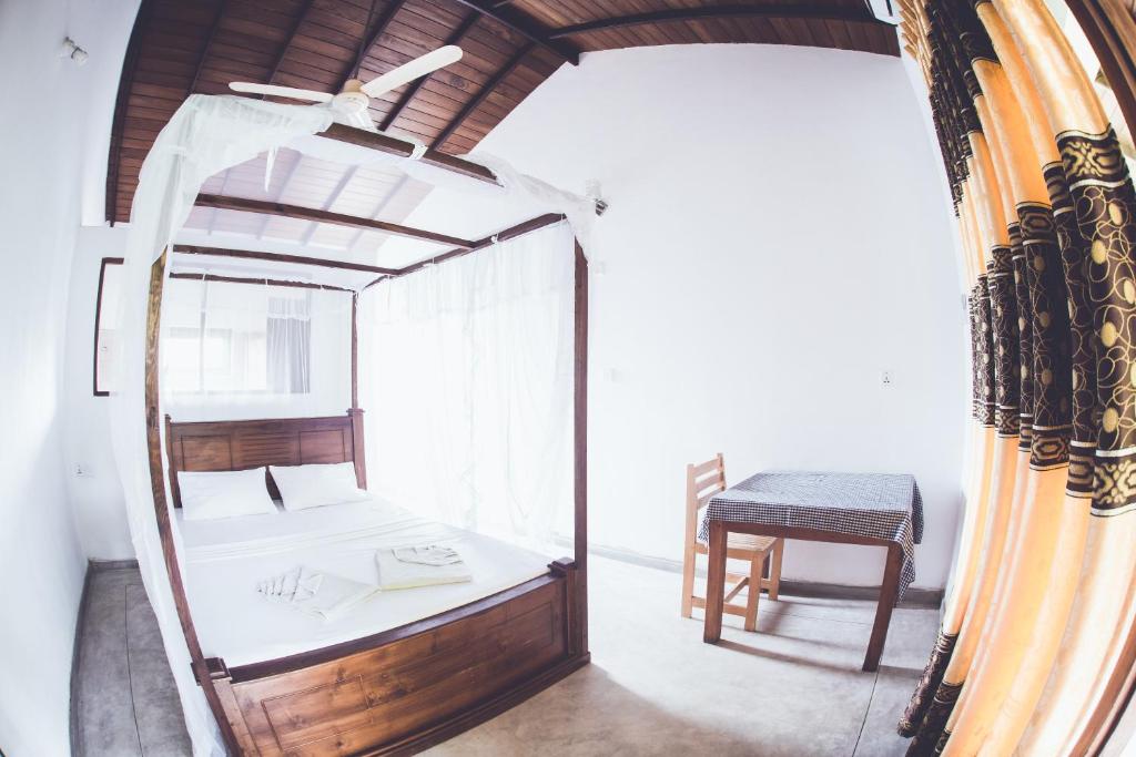 Postel nebo postele na pokoji v ubytování Rupa's Hotel