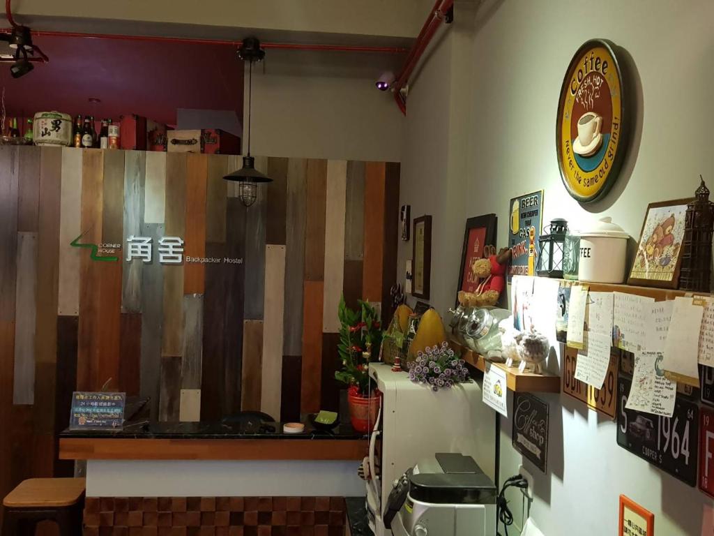 a restaurant with a counter in a room at 角舍背包客棧 -近火車站 in Hualien City