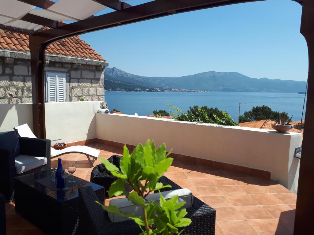 a balcony with a view of the water at Holiday home Gabriela in Korčula