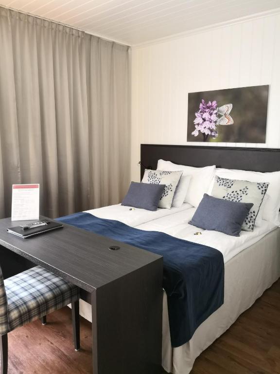 Postel nebo postele na pokoji v ubytování Vollan Gjestestue