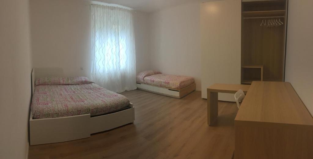 Appartamento Duca tesisinde bir odada yatak veya yataklar