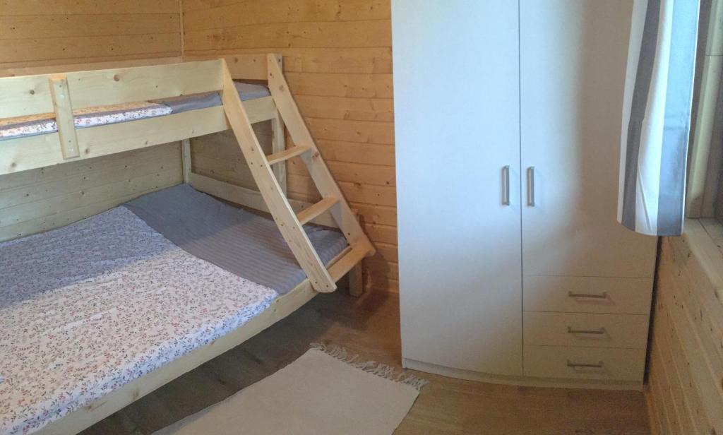 Postel nebo postele na pokoji v ubytování Lesna Domki Letniskowe