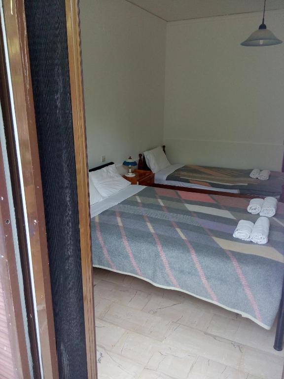 Postel nebo postele na pokoji v ubytování Hotel Dougas