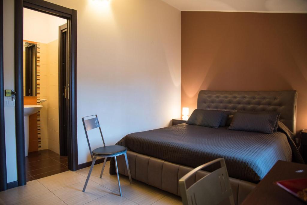 Postel nebo postele na pokoji v ubytování Acitrezza B&B