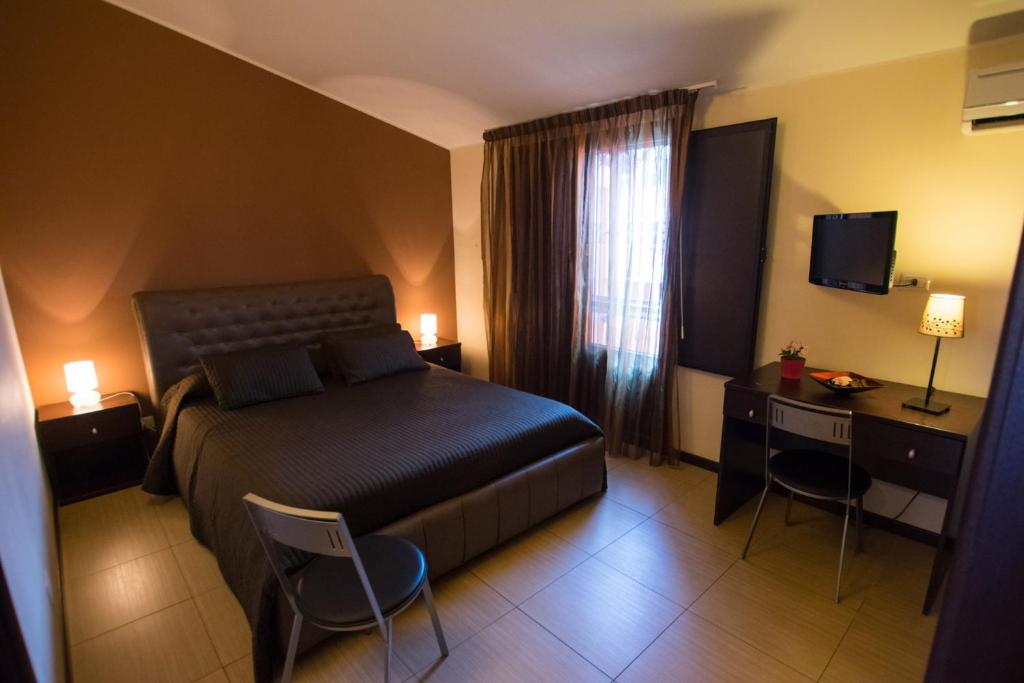 Postel nebo postele na pokoji v ubytování Acitrezza B&B