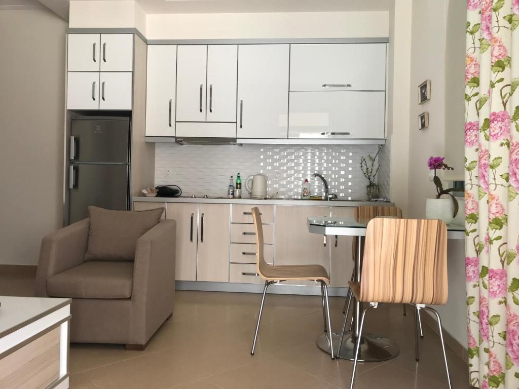 A kitchen or kitchenette at White Jasmine Apartment