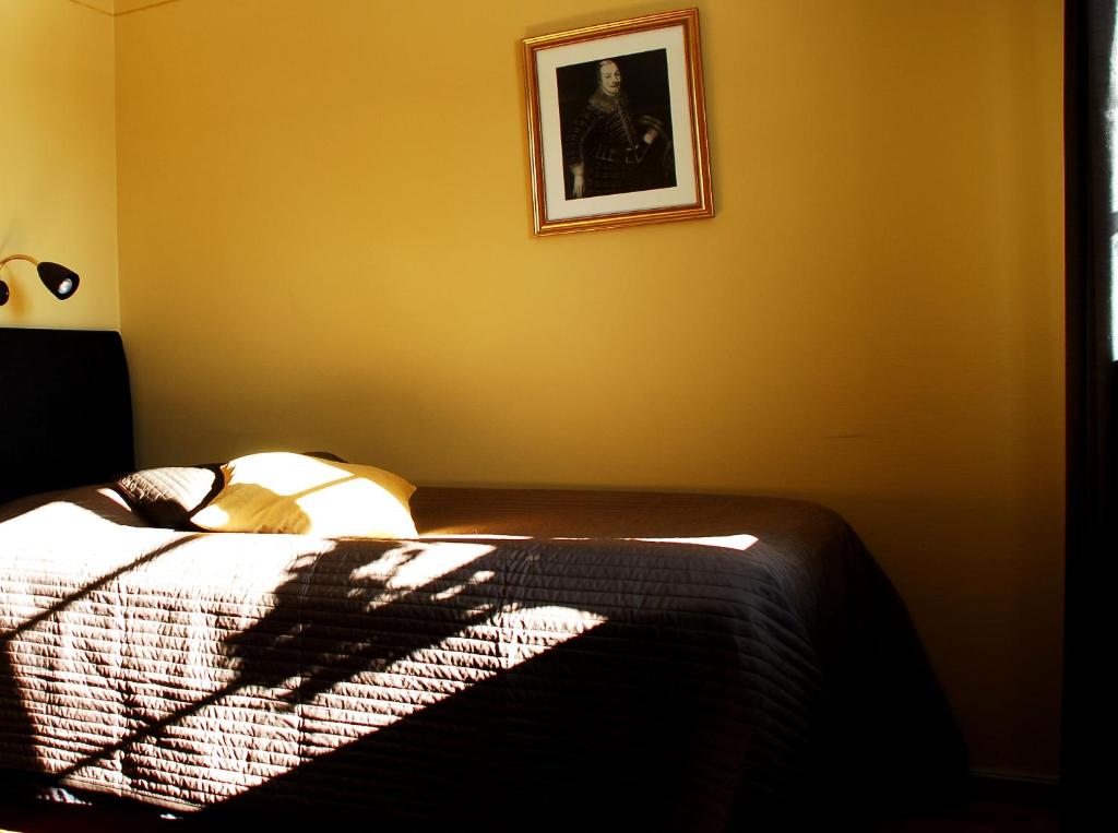Postel nebo postele na pokoji v ubytování Hotell Laurentius