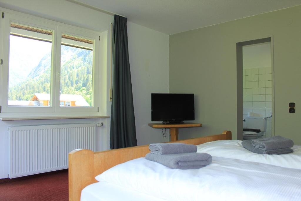 Postel nebo postele na pokoji v ubytování KWT Lodge