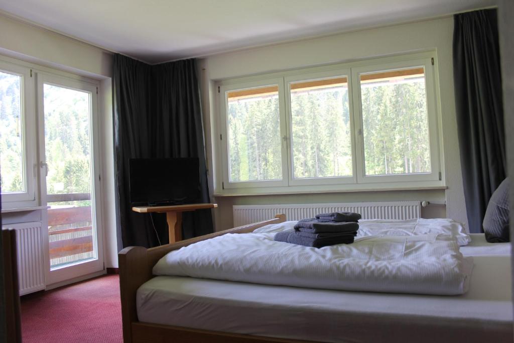 Postel nebo postele na pokoji v ubytování KWT Lodge