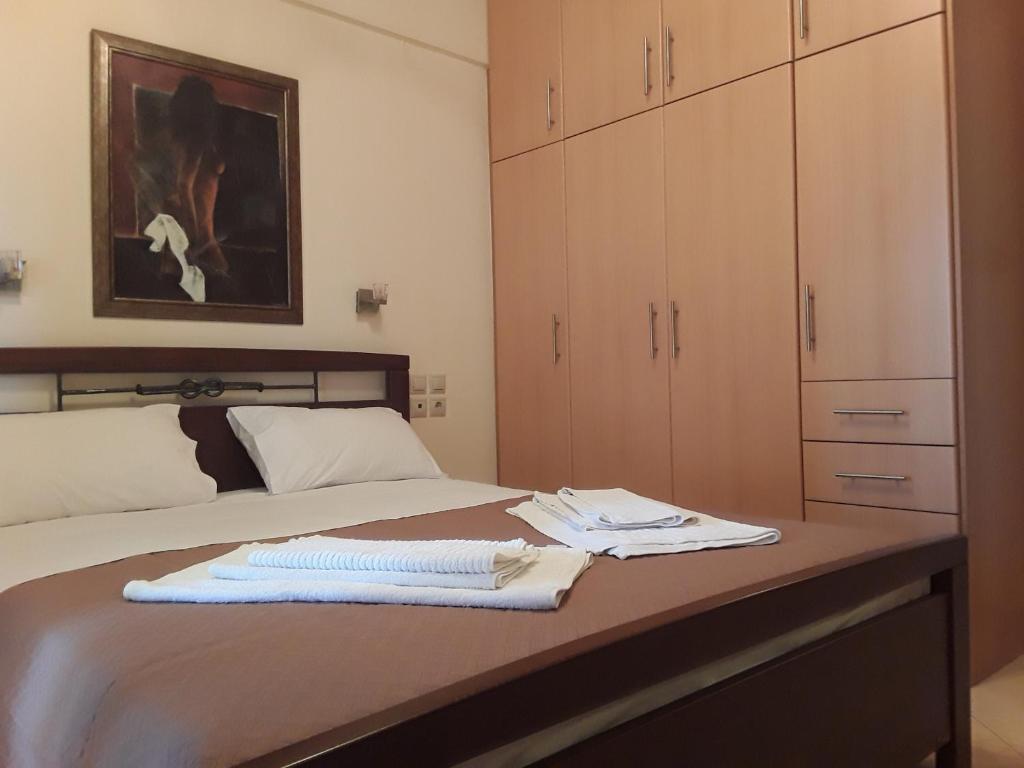 Кровать или кровати в номере Dais Apartments