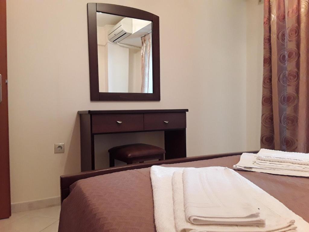 Кровать или кровати в номере Dais Apartments