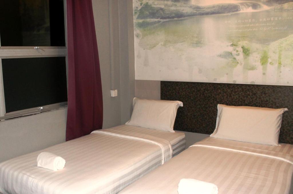 Postel nebo postele na pokoji v ubytování Jabez Resort Kundasang