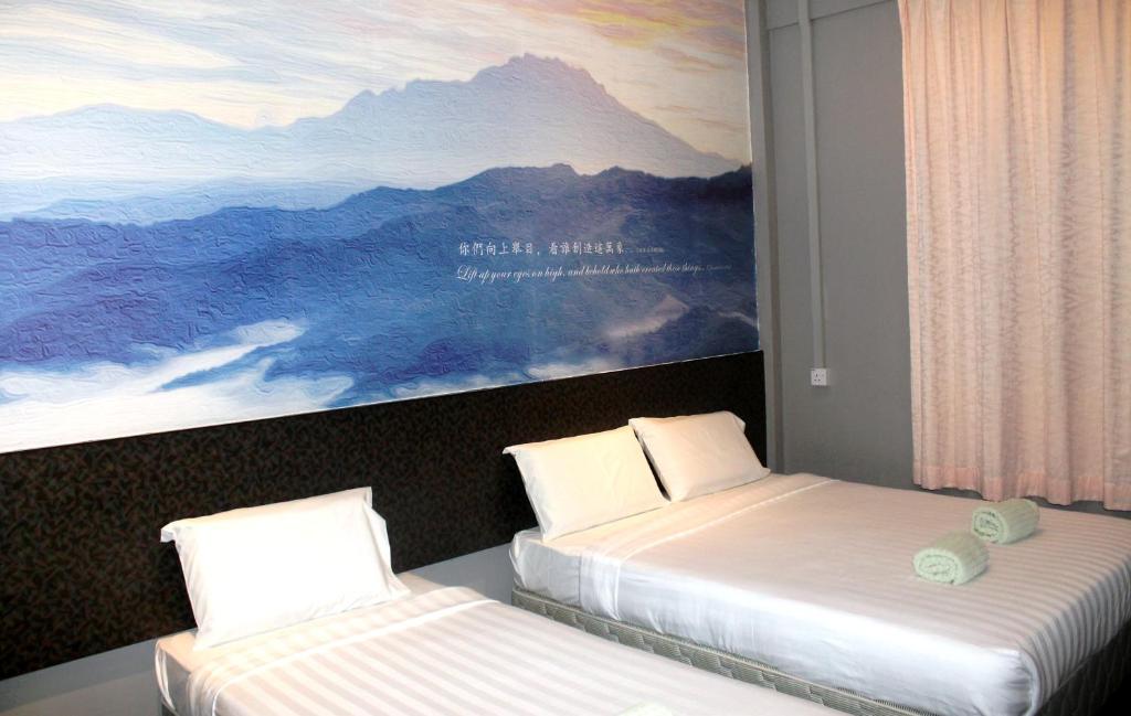 Postel nebo postele na pokoji v ubytování Jabez Resort Kundasang