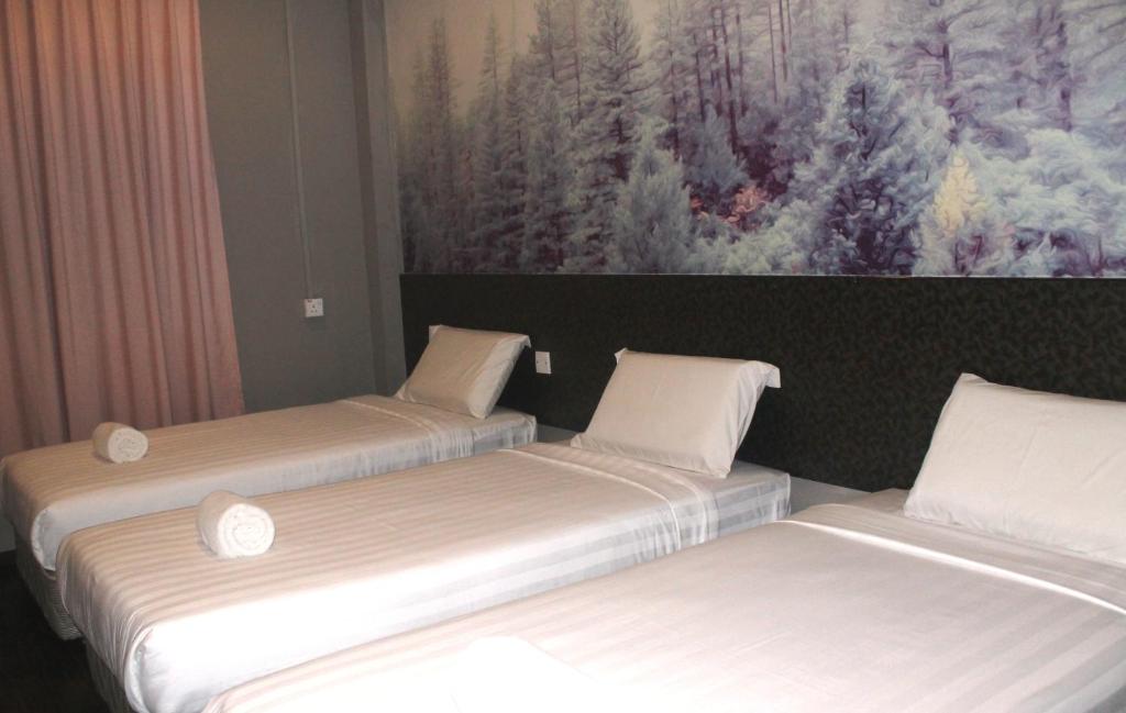 Postel nebo postele na pokoji v ubytování Jabez Resort Kundasang