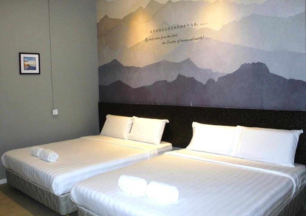 Postel nebo postele na pokoji v ubytování Jabez Resort Kundasang