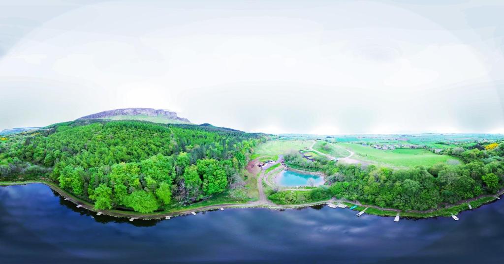 an aerial view of an island in the water at Waterfall Caves in Limavady