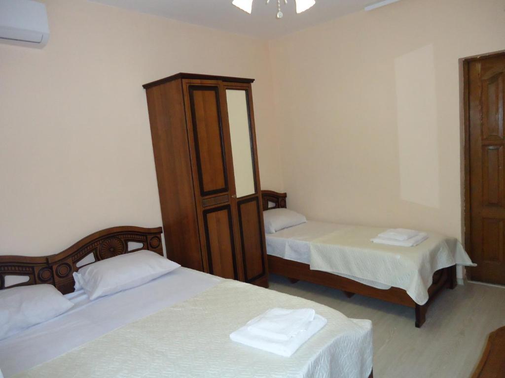 A bed or beds in a room at Guest house Anaida