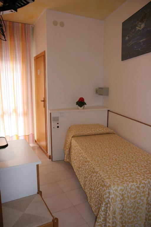 Postel nebo postele na pokoji v ubytování Hotel Paron